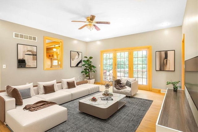 245 SW 400th Rd, Warrensburg, MO 64093 - living area with ceiling fan and light wood-style flooring