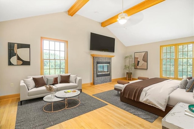 245 SW 400th Rd, Warrensburg, MO 64093 - living area featuring wood finished floors, plenty of natural light, a fireplace, and ceiling fan