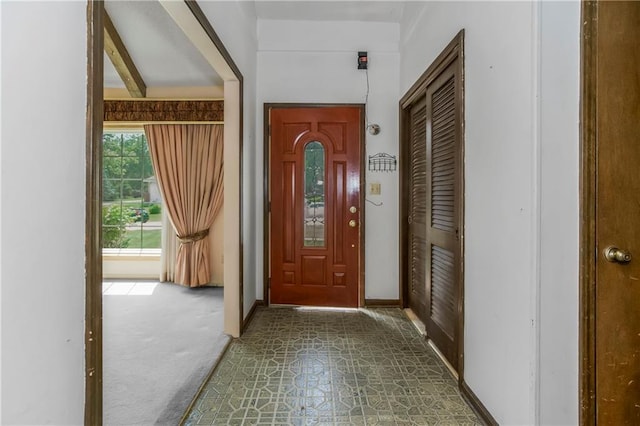12417 Newton Ct, Grandview, MO 64030 - entrance foyer with baseboards and tile patterned floors