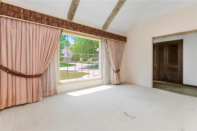 12417 Newton Ct, Grandview, MO 64030 - spare room with vaulted ceiling, carpet, and healthy amount of natural light