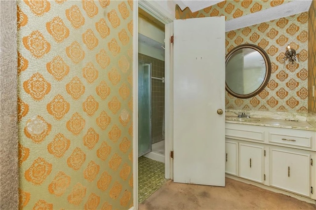 12417 Newton Ct, Grandview, MO 64030 - bathroom featuring wallpapered walls, vanity, and a walk in shower
