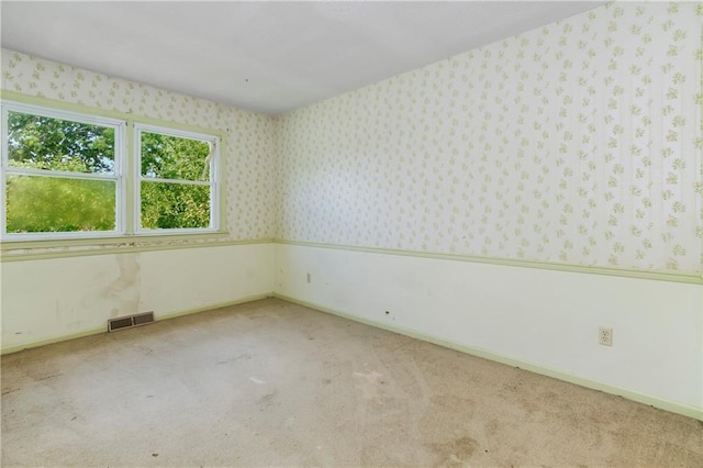 12417 Newton Ct, Grandview, MO 64030 - unfurnished room with carpet flooring and wallpapered walls