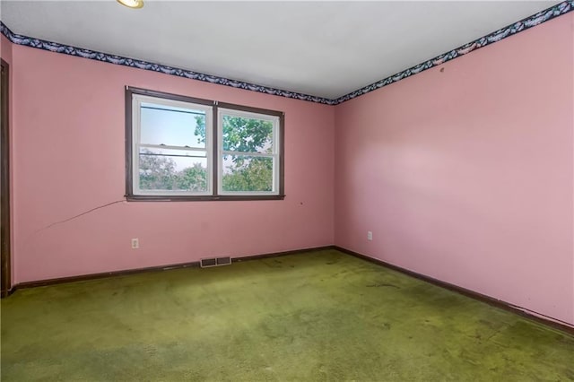 12417 Newton Ct, Grandview, MO 64030 - empty room featuring baseboards and carpet flooring