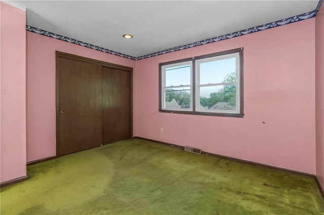 12417 Newton Ct, Grandview, MO 64030 - unfurnished bedroom featuring light carpet, a closet, and recessed lighting