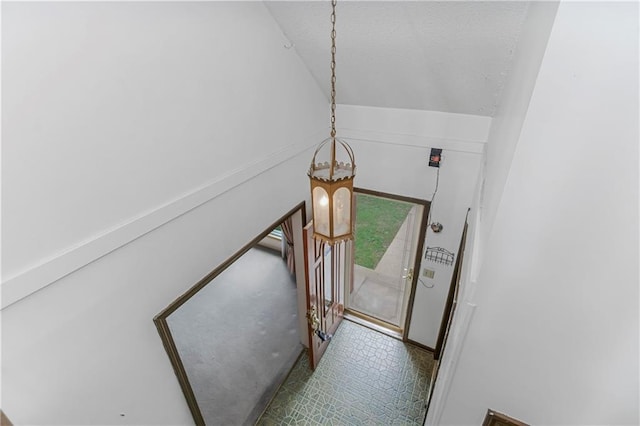 12417 Newton Ct, Grandview, MO 64030 - stairway with vaulted ceiling and tile patterned floors