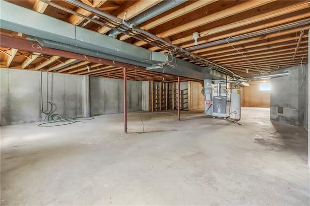 12417 Newton Ct, Grandview, MO 64030 - unfinished below grade area with gas water heater and heating unit
