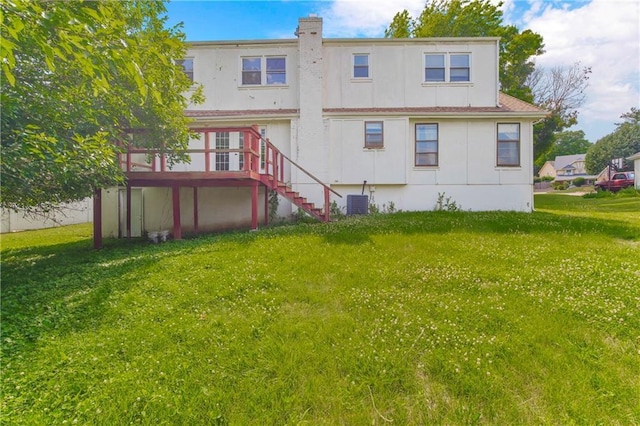 12417 Newton Ct, Grandview, MO 64030 - back of house with stairway, a lawn, and a wooden deck