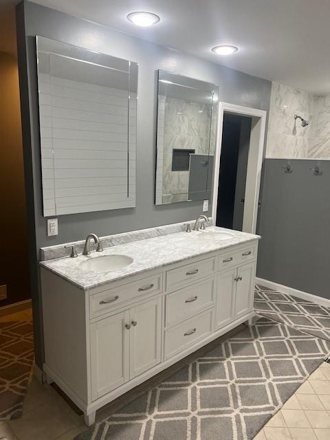 1901 NE River Ridge Rd, Saint Joseph, MO 64507 - full bathroom with double vanity, a shower, and tile patterned floors