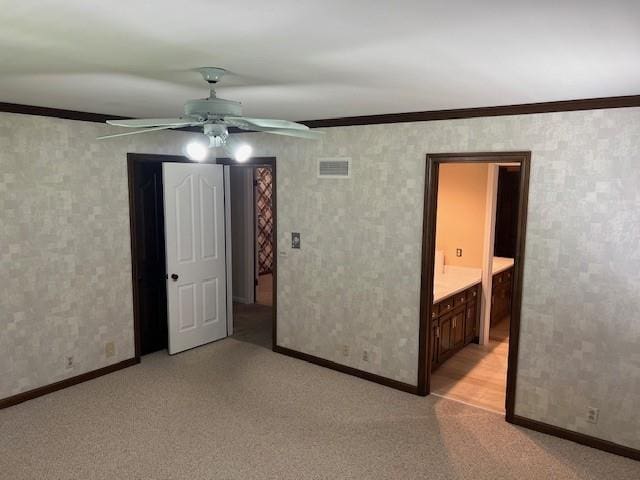 1901 NE River Ridge Rd, Saint Joseph, MO 64507 - unfurnished room featuring ornamental molding, ceiling fan, and light colored carpet