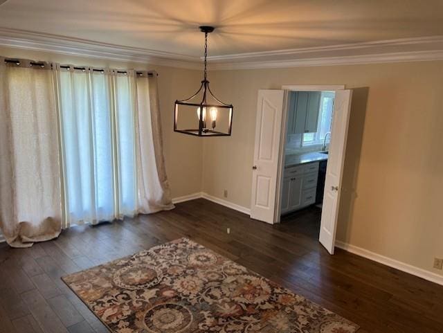 1901 NE River Ridge Rd, Saint Joseph, MO 64507 - unfurnished dining area featuring dark wood-type flooring and ornamental molding