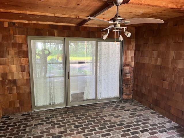 1901 NE River Ridge Rd, Saint Joseph, MO 64507 - unfurnished sunroom with beamed ceiling