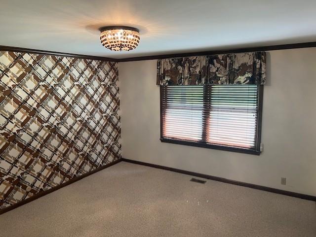 1901 NE River Ridge Rd, Saint Joseph, MO 64507 - spare room featuring light colored carpet
