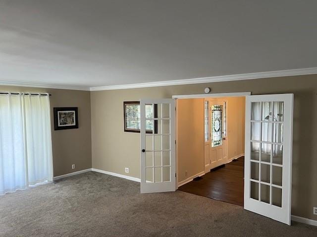 1901 NE River Ridge Rd, Saint Joseph, MO 64507 - unfurnished room with ornamental molding, dark colored carpet, and french doors