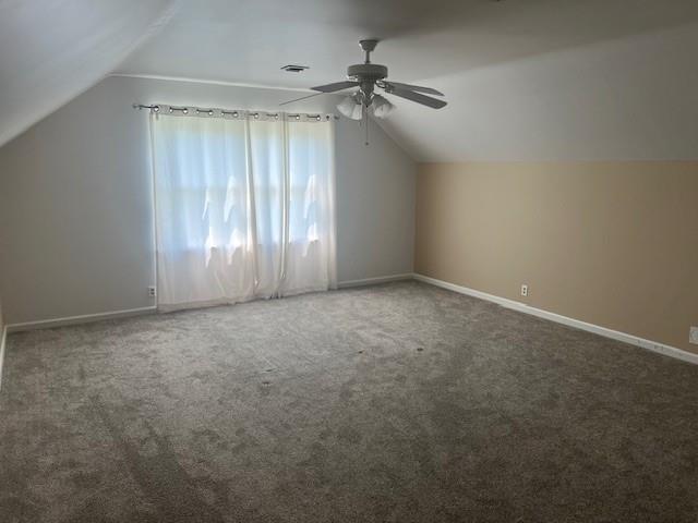 1901 NE River Ridge Rd, Saint Joseph, MO 64507 - additional living space featuring vaulted ceiling, ceiling fan, and carpet floors