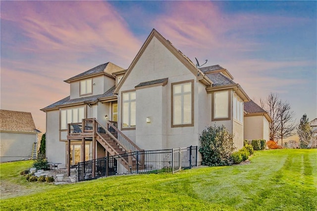 10654 W 168th Ct, Overland Park, KS 66221 - back of house at dusk with stucco siding and stairway