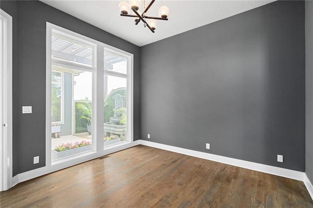 17117 Bluejacket St, Overland Park, KS 66221 - empty room with a chandelier and wood finished floors