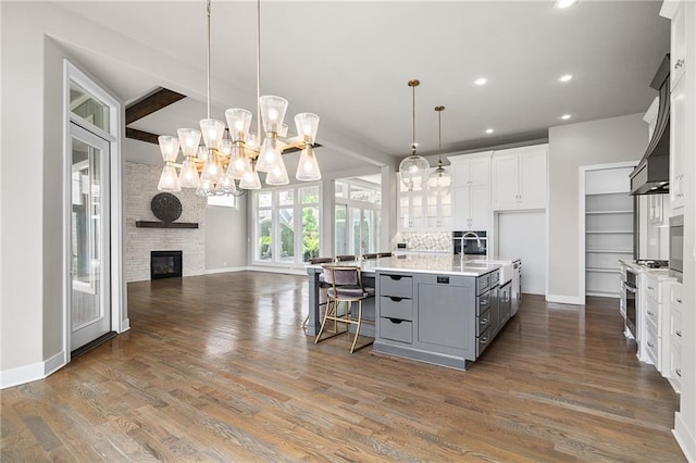 17117 Bluejacket St, Overland Park, KS 66221 - kitchen with gray cabinets, open floor plan, recessed lighting, white cabinetry, and light countertops