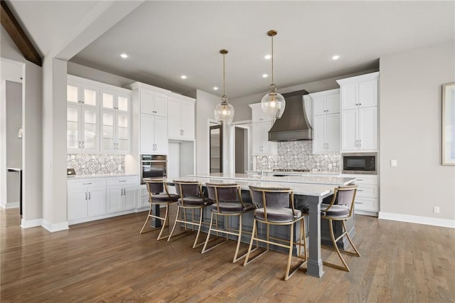 17117 Bluejacket St, Overland Park, KS 66221 - kitchen with premium range hood, stainless steel appliances, backsplash, white cabinets, and recessed lighting