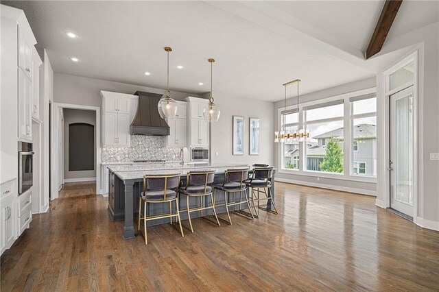 17117 Bluejacket St, Overland Park, KS 66221 - kitchen with custom exhaust hood, appliances with stainless steel finishes, recessed lighting, backsplash, and white cabinetry