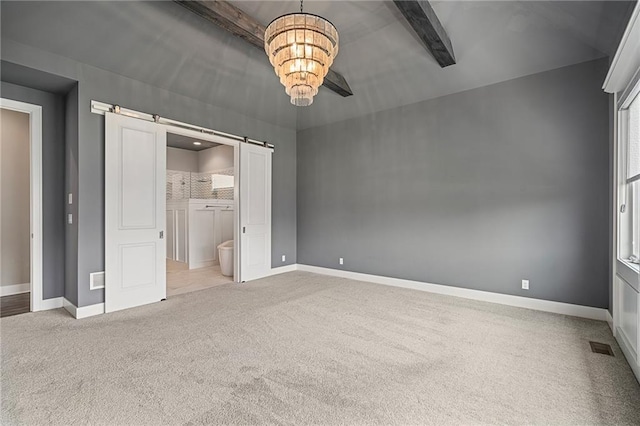 17117 Bluejacket St, Overland Park, KS 66221 - unfurnished bedroom featuring a barn door, carpet floors, a chandelier, connected bathroom, and beam ceiling