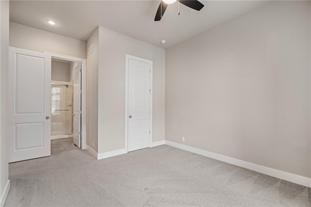 17117 Bluejacket St, Overland Park, KS 66221 - unfurnished bedroom with light colored carpet, ensuite bath, and ceiling fan
