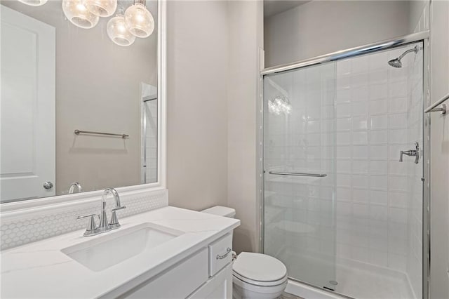 17117 Bluejacket St, Overland Park, KS 66221 - bathroom with a shower stall, vanity, and a chandelier