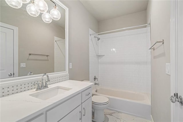 17117 Bluejacket St, Overland Park, KS 66221 - bathroom with marble look tiles, vanity,  shower combination, and a chandelier