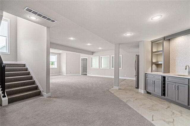 17117 Bluejacket St, Overland Park, KS 66221 - basement featuring freestanding refrigerator, stairway, recessed lighting, and light carpet