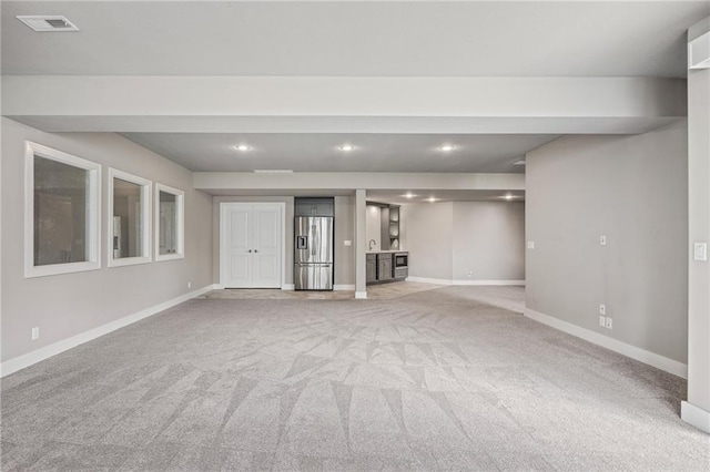 17117 Bluejacket St, Overland Park, KS 66221 - unfurnished living room featuring light colored carpet and recessed lighting