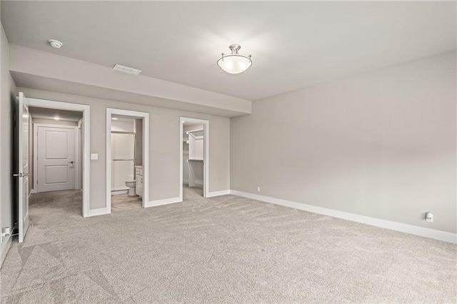17117 Bluejacket St, Overland Park, KS 66221 - unfurnished bedroom with light carpet, a walk in closet, a closet, and ensuite bathroom