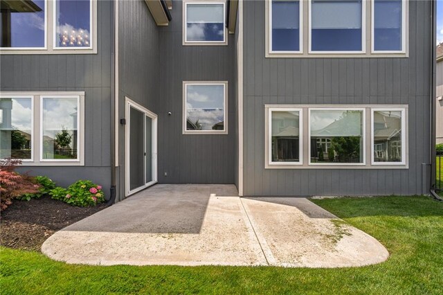 17117 Bluejacket St, Overland Park, KS 66221 - property entrance featuring a patio and a yard
