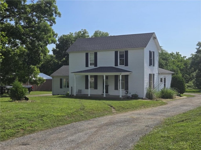 18916 166th St, Basehor, KS 66007 - view of front of home featuring covered porch, a front lawn, a shingled roof, and asphalt driveway