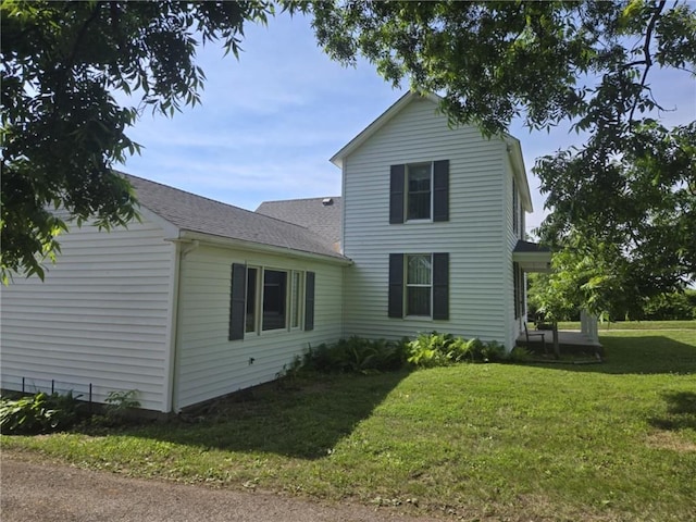 18916 166th St, Basehor, KS 66007 - back of house with a yard and a shingled roof
