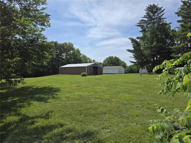 18916 166th St, Basehor, KS 66007 - view of grassy yard featuring a pole building and an outdoor structure