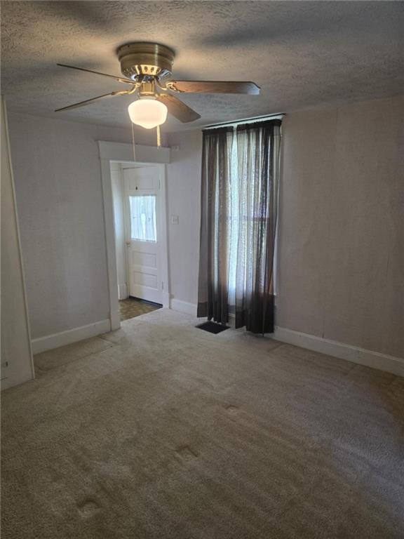 18916 166th St, Basehor, KS 66007 - empty room featuring ceiling fan, carpet floors, and a textured ceiling