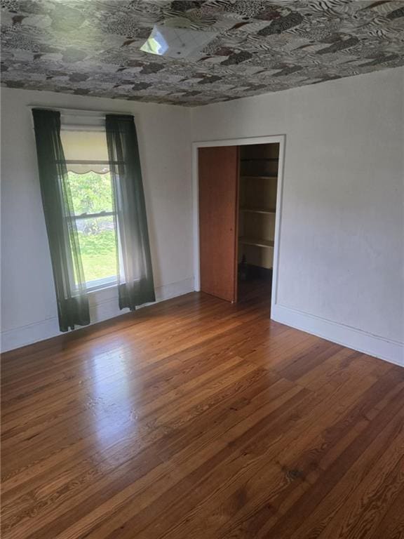 18916 166th St, Basehor, KS 66007 - empty room featuring wood finished floors and an ornate ceiling