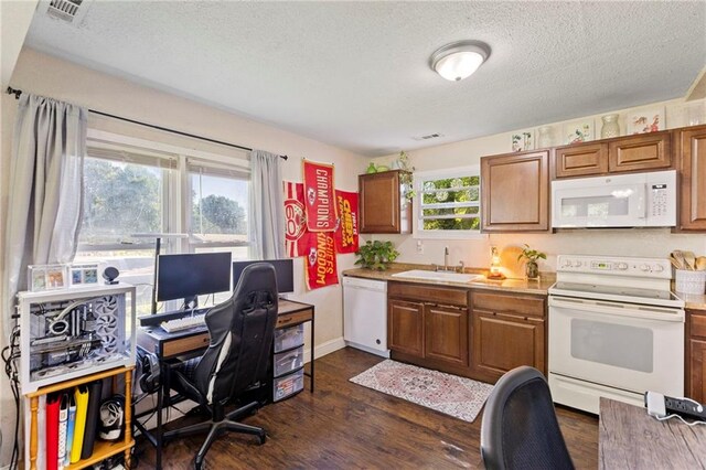 5525 NE Meadowbrook Rd, Kansas City, MO 64119 - kitchen with white appliances, a textured ceiling, dark wood-type flooring, brown cabinets, and a desk