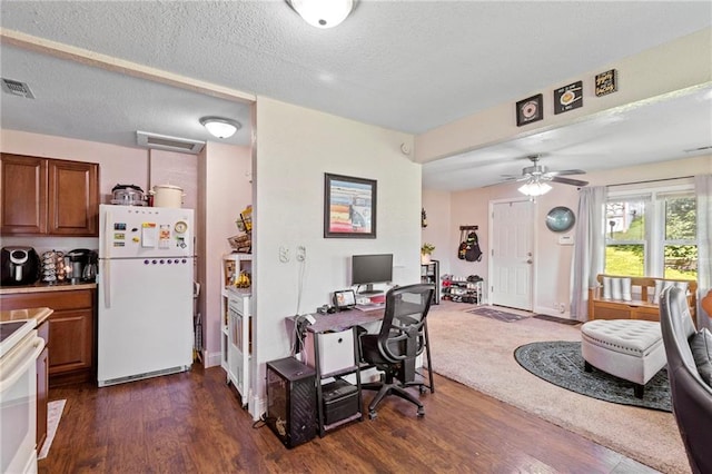 5525 NE Meadowbrook Rd, Kansas City, MO 64119 - home office with dark wood-type flooring, ceiling fan, and a textured ceiling