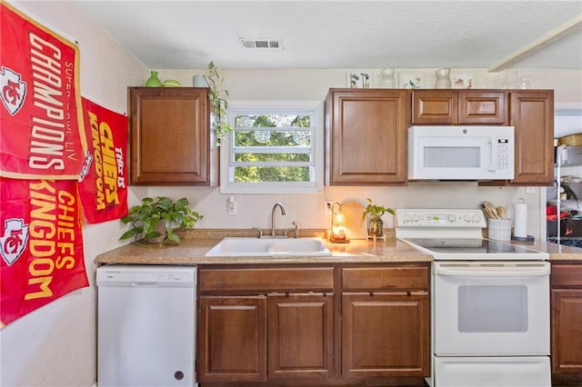 5525 NE Meadowbrook Rd, Kansas City, MO 64119 - kitchen featuring white appliances, brown cabinetry, and light countertops