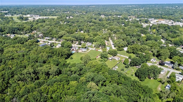5525 NE Meadowbrook Rd, Kansas City, MO 64119 - aerial overview of property's location with a heavily wooded area