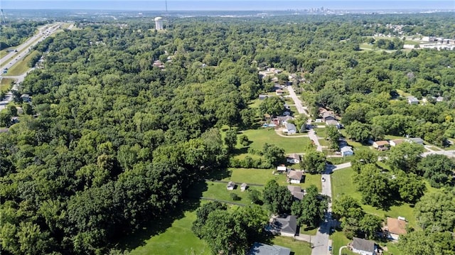 5525 NE Meadowbrook Rd, Kansas City, MO 64119 - aerial overview of property's location with a forest