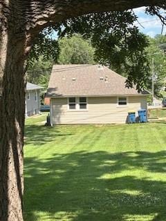 114 S Appleton St, Sugar Creek, MO 64054 - back of house with a yard