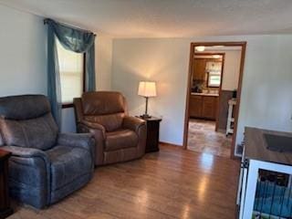 114 S Appleton St, Sugar Creek, MO 64054 - sitting room featuring wood finished floors