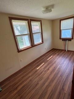 114 S Appleton St, Sugar Creek, MO 64054 - unfurnished room with wood finished floors