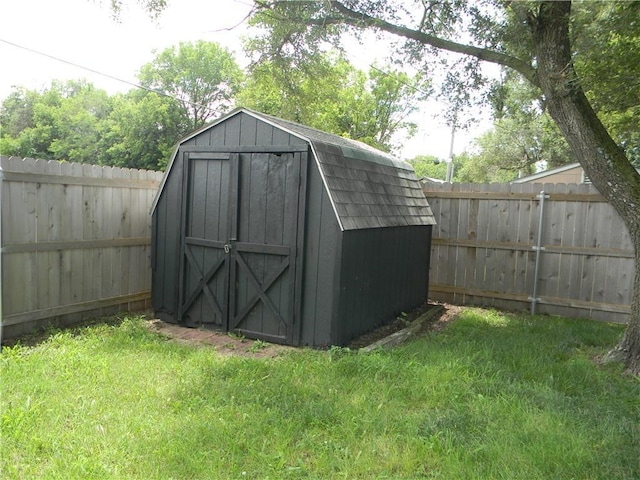 811 E Garfield St, Iola, KS 66749 - view of shed featuring a fenced backyard