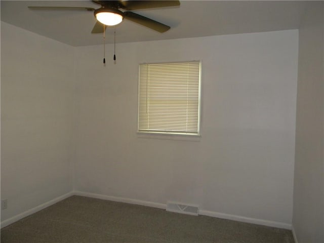 811 E Garfield St, Iola, KS 66749 - carpeted spare room with a ceiling fan and baseboards