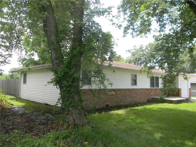 811 E Garfield St, Iola, KS 66749 - view of home's exterior with brick siding