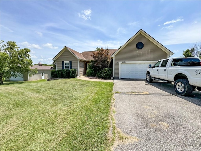 19683 K 68 Hwy, Paola, KS 66071 - view of front of property featuring asphalt driveway, a front lawn, and a garage
