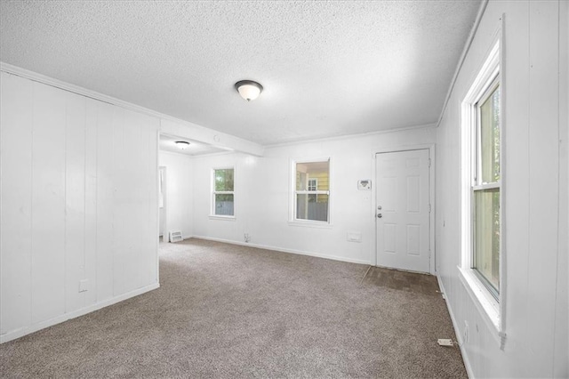 6701 Walrond Ave, Kansas City, MO 64132 - spare room with carpet floors, a textured ceiling, and ornamental molding