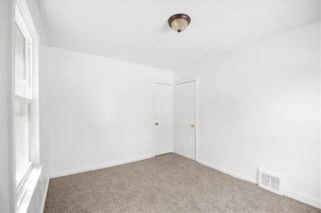 6701 Walrond Ave, Kansas City, MO 64132 - carpeted spare room with baseboards